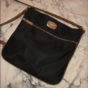 Used Michael Kors flat cross body purse